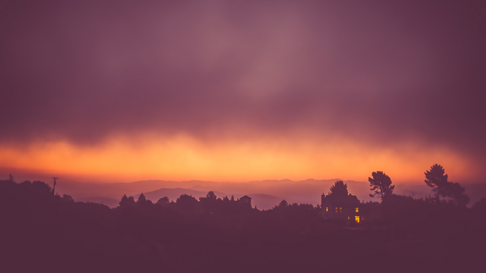House in mist during sunset landscape