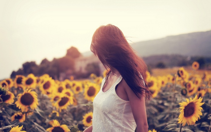 Woman in a sunflower field
