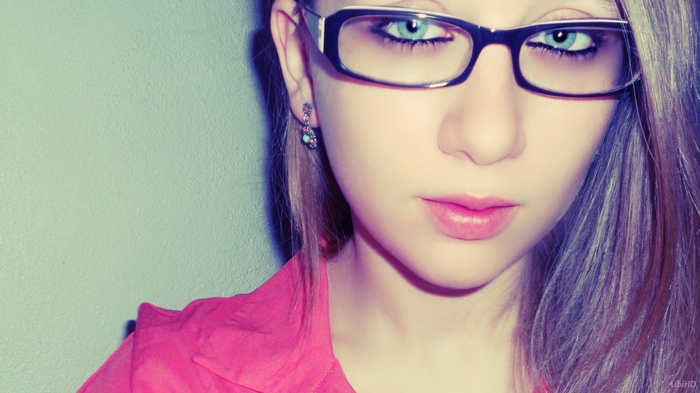 Woman with blue eyes and glasses
