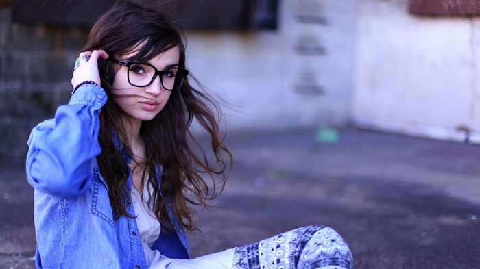 Woman with glasses and blue shirt