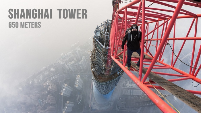 Man climbing Shanghai Tower crane at 650 meters
