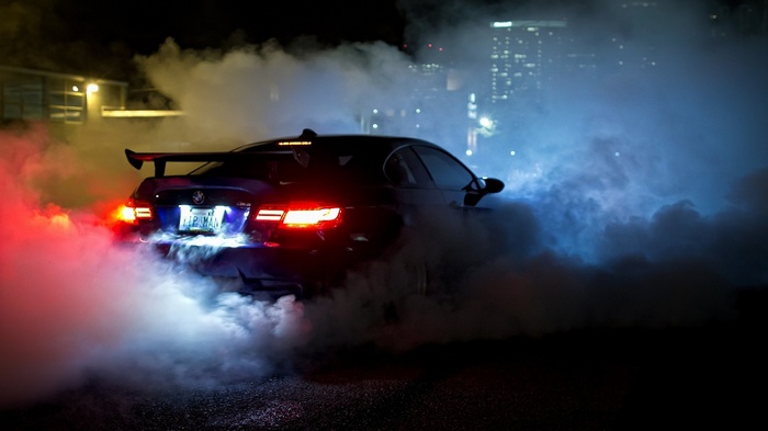 BMW M3 doing a burnout at night