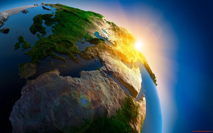 Earth from space with sunrise over Europe and Africa