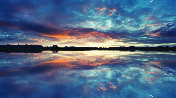 Sunset clouds reflected in a calm lake
