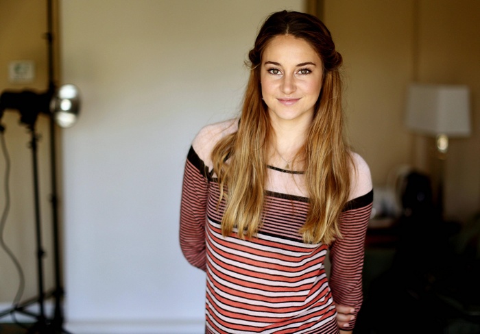 Shailene Woodley smiling in a striped shirt