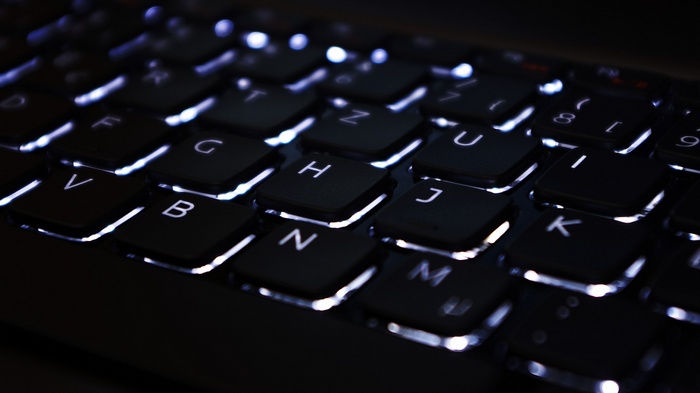 ASUS laptop keyboard with white backlighting