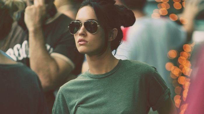 Megan Fox wearing sunglasses in a crowd
