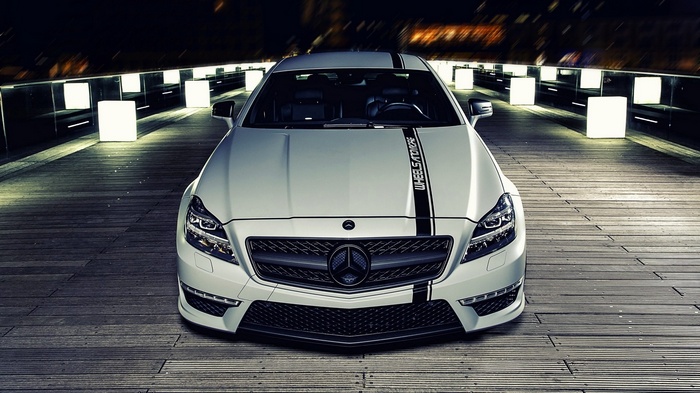White Mercedes-Benz CLS with racing stripes