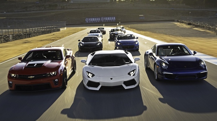 Group of Supercars on a Race Track