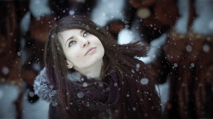Woman looking up at snow