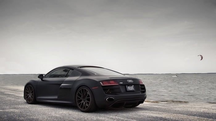 Matte black Audi R8 parked by the water