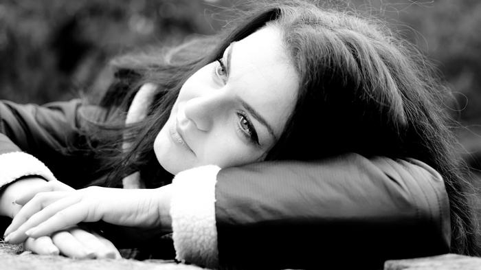 Monochrome closeup of a woman lying down