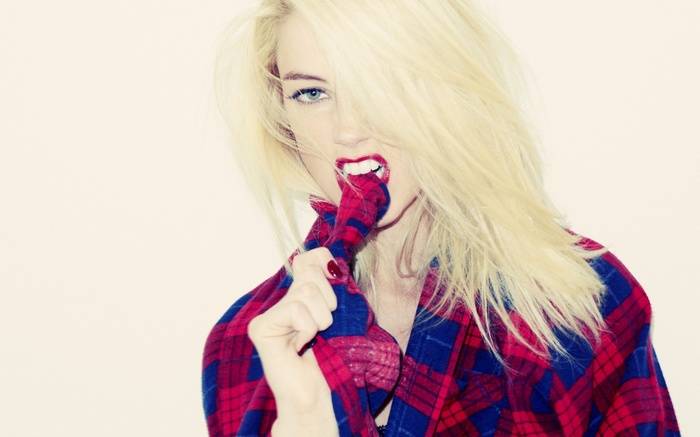 Amber Heard biting her plaid shirt