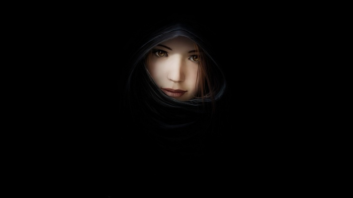 Artwork of a woman's face in darkness