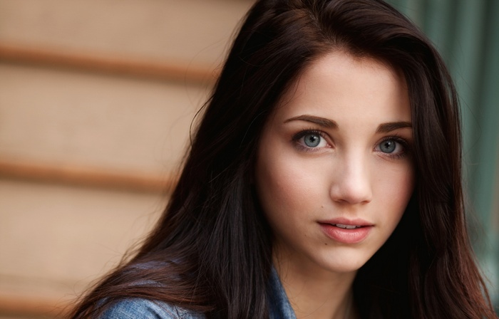 Emily Rudd portrait with blue eyes and long dark hair
