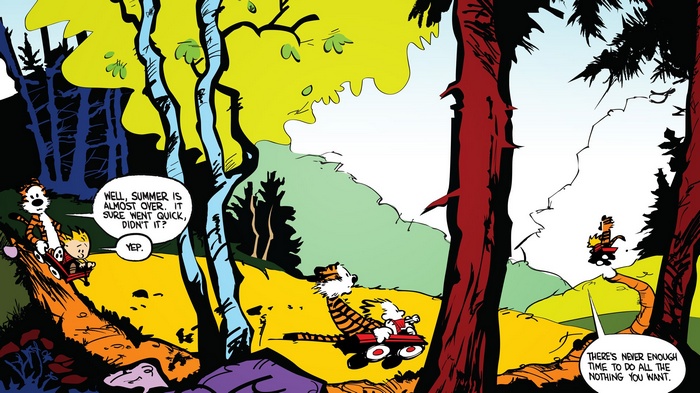 Calvin and Hobbes ride wagons in a colorful forest