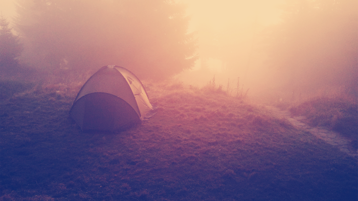 Tent in the mist at sunrise
