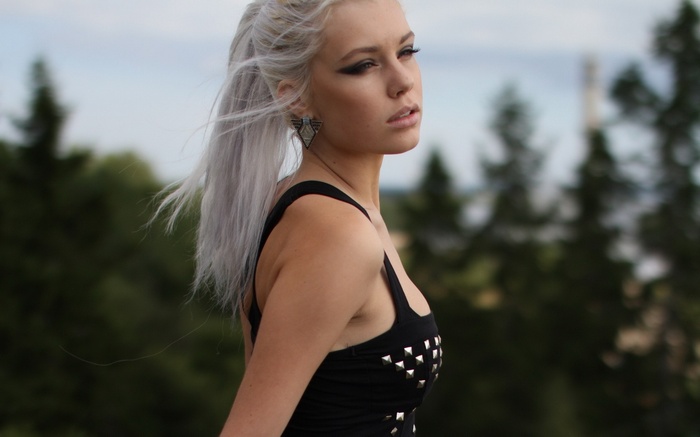 Woman with platinum blonde hair outdoors