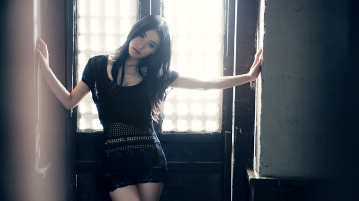 Asian woman with dark hair in a black dress