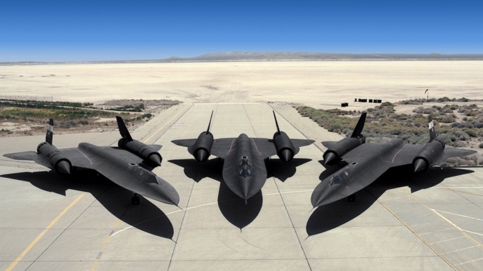 Three Lockheed SR-71 Blackbird aircraft on a runway