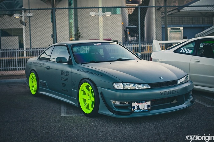Nissan Silvia S14 JDM with neon wheels