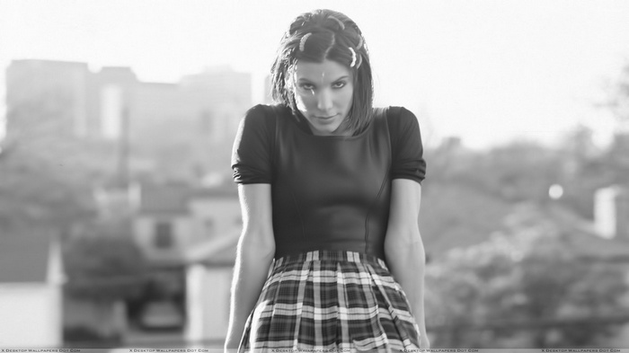 Sandra Bullock in monochrome with plaid skirt