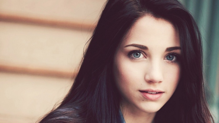 Emily Rudd portrait with blue eyes and long dark hair