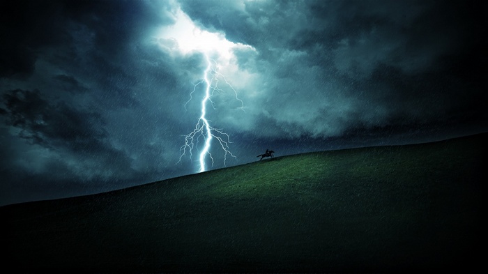 Horse rider in a lightning storm