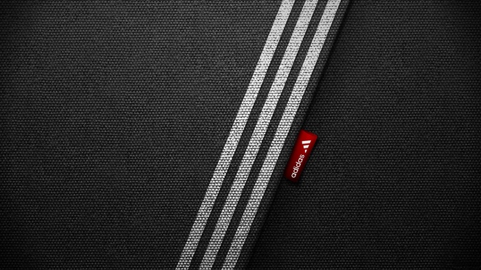 Adidas logo and stripes on black fabric