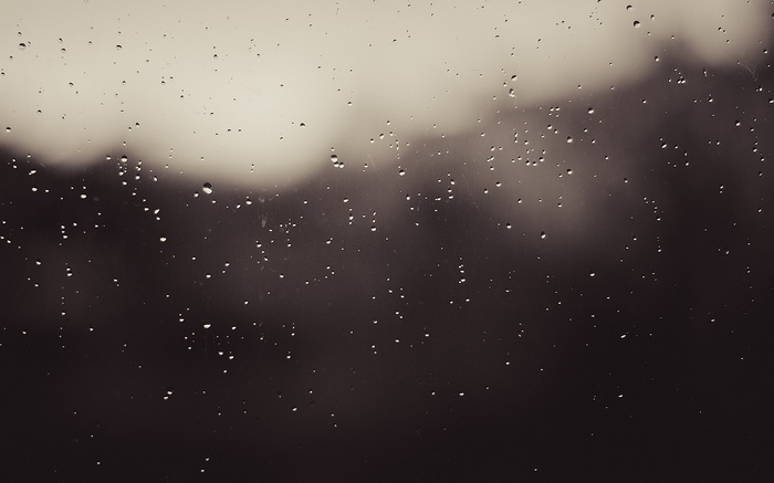 Water drops on glass with blurred background