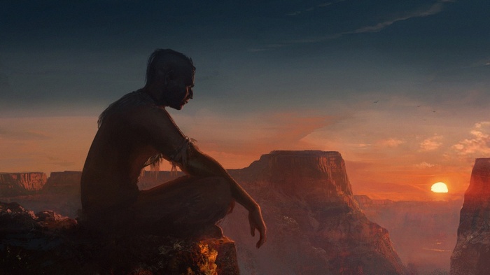 Native American Shaman meditating at sunset in Grand Canyon