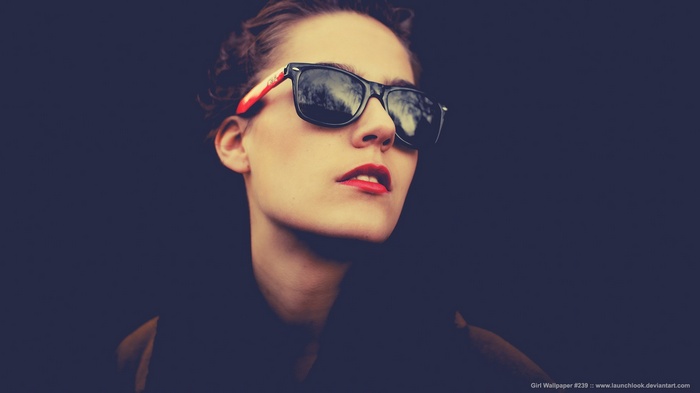 Woman wearing sunglasses and red lipstick