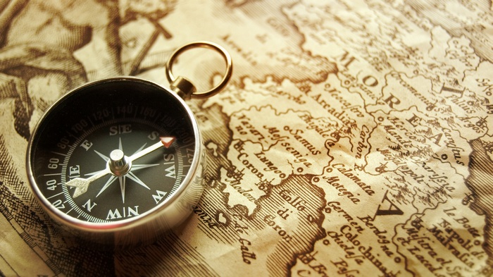 Vintage compass on an old map