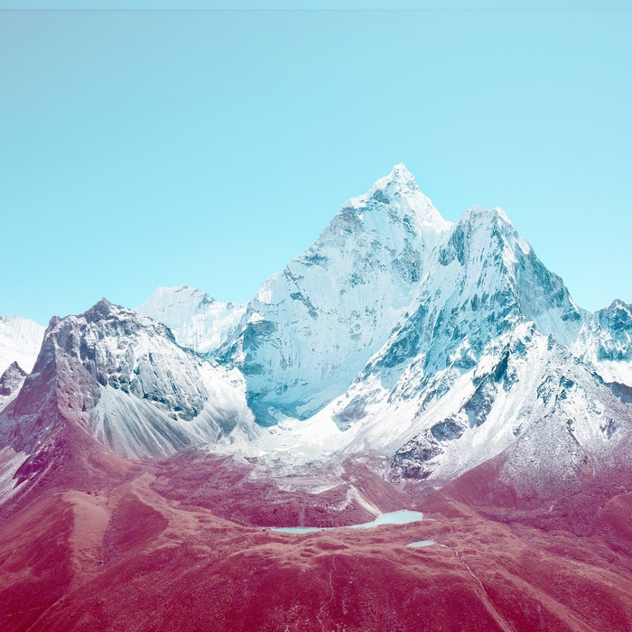 Snow-capped mountains under a clear blue sky