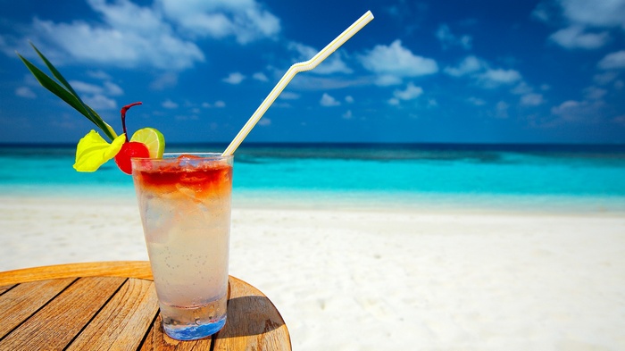 Tropical drink on a beach with ocean view
