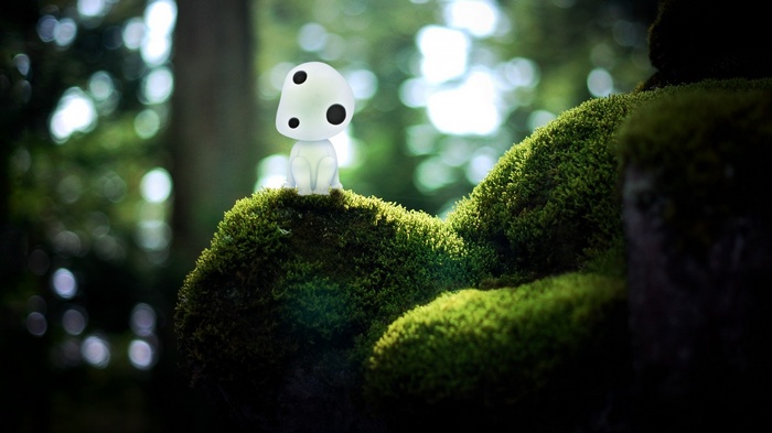 Kodama from Princess Mononoke on mossy rocks