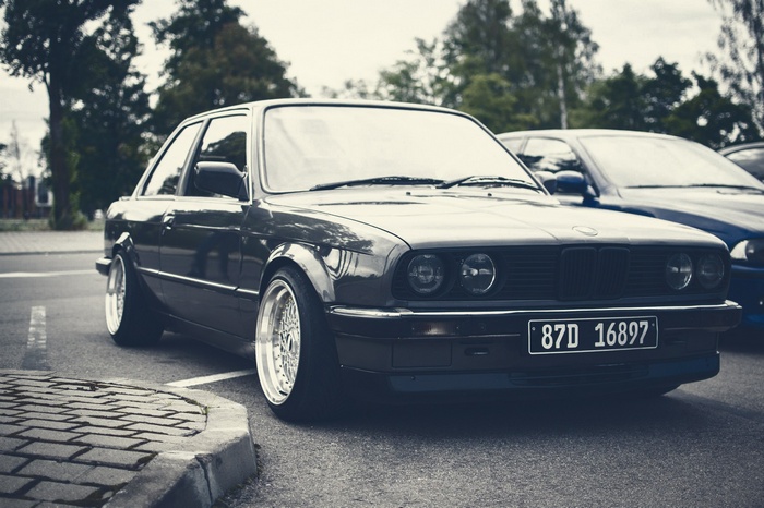 BMW E30 parked on a street
