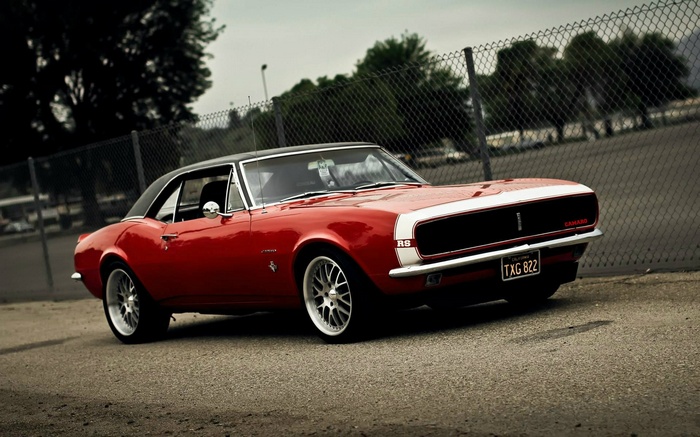 Red 1967 Chevrolet Camaro RS parked outdoors