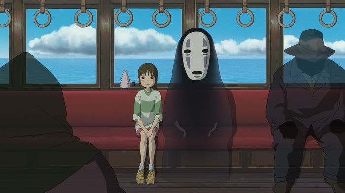 Chihiro and No-Face on a train in Spirited Away