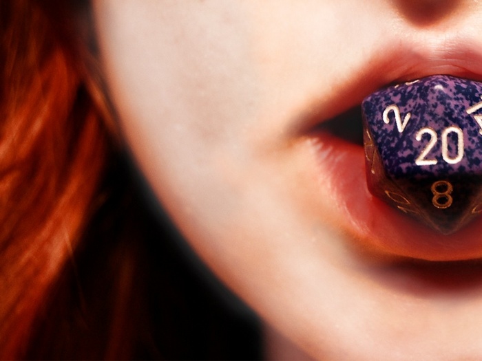 Woman with a twenty-sided die in her mouth