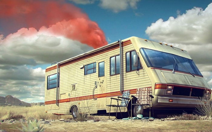 RV with red smoke in the desert