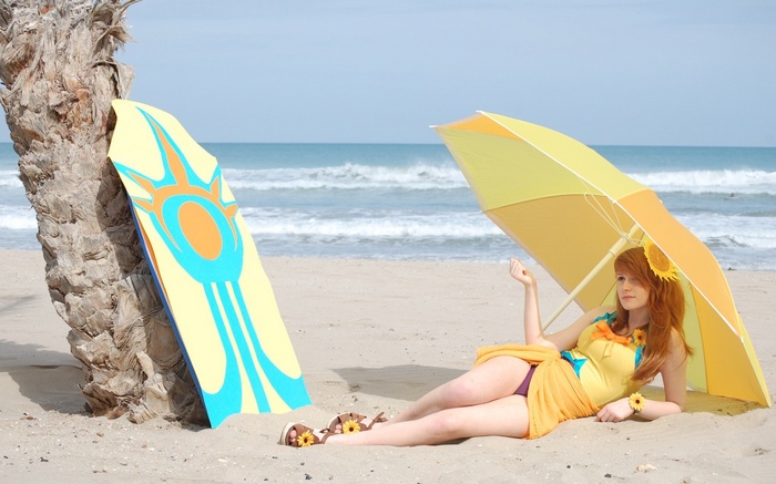 Leona from League of Legends on a beach with a surfboard
