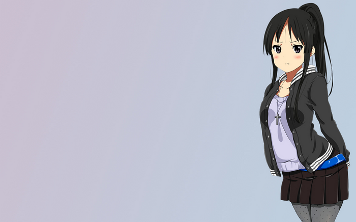 Akiyama Mio from K-ON! standing against a simple background
