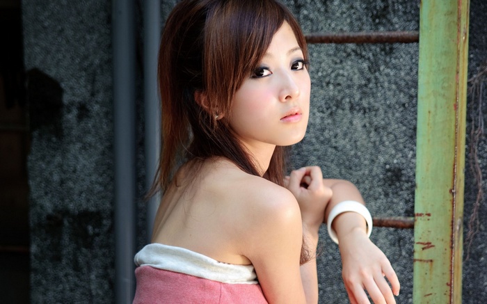Asian woman looking at viewer