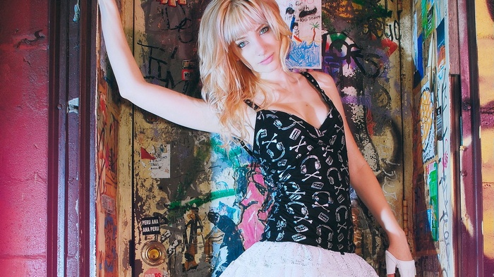 Susan Coffey in a graffiti-covered doorway