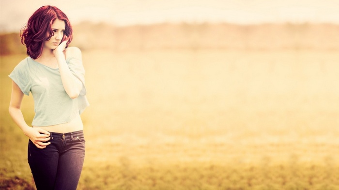 Susan Coffey in a field with jeans and a shirt
