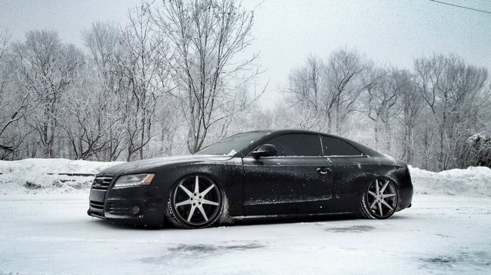 Black Audi A5 coupe in the snow