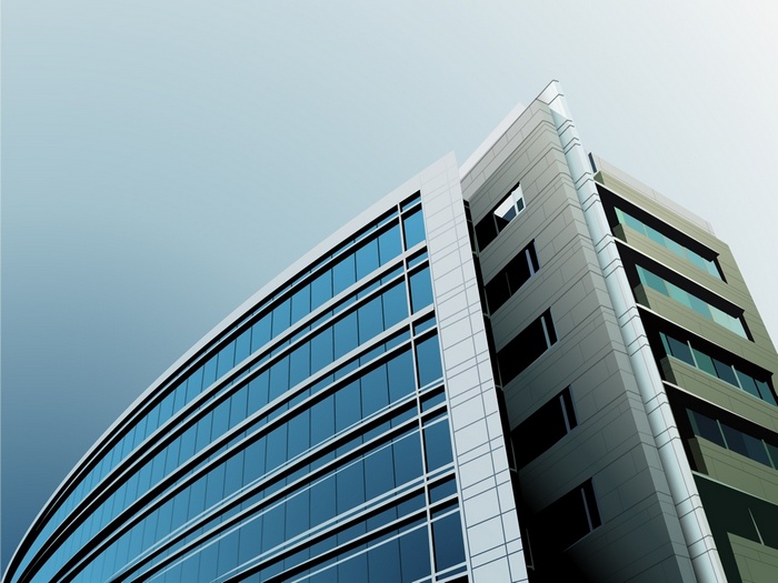 Modern office building with glass facade against a clear sky