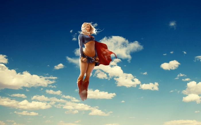 Supergirl flying in a blue sky with clouds