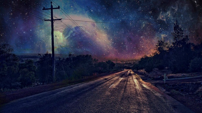 Road under a starry nebula sky